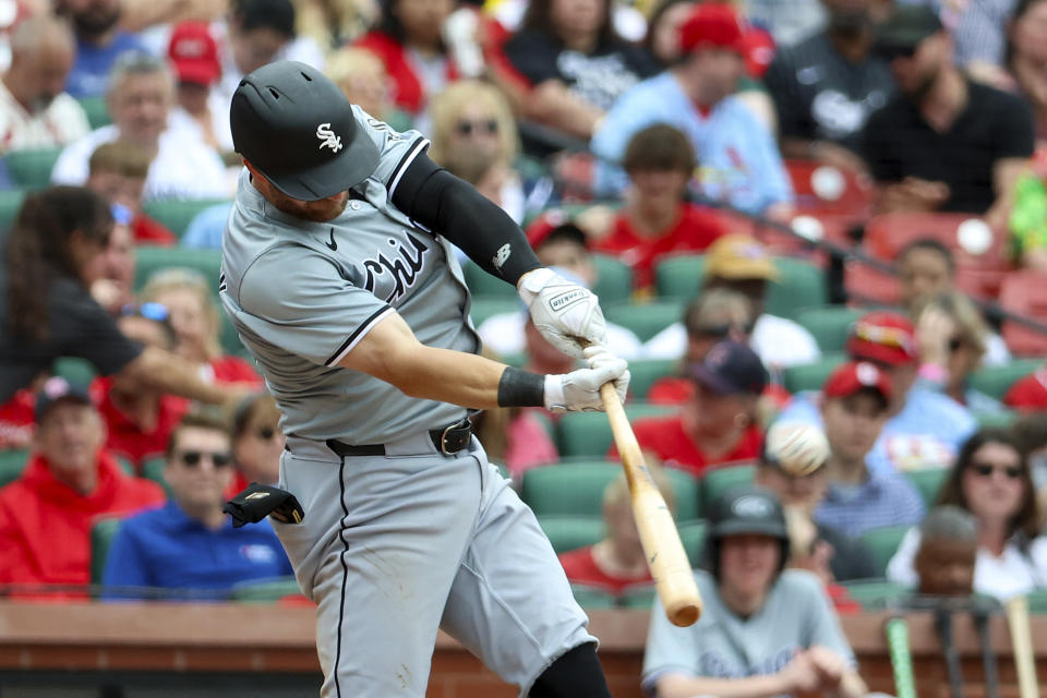Chicago White Sox's Robbie Grossman hits a sacrifice fly during the seventh inning of a baseball game against the St. Louis Cardinalsm Sunday, May 5, 2024, in St. Louis. (AP Photo/Scott Kane)