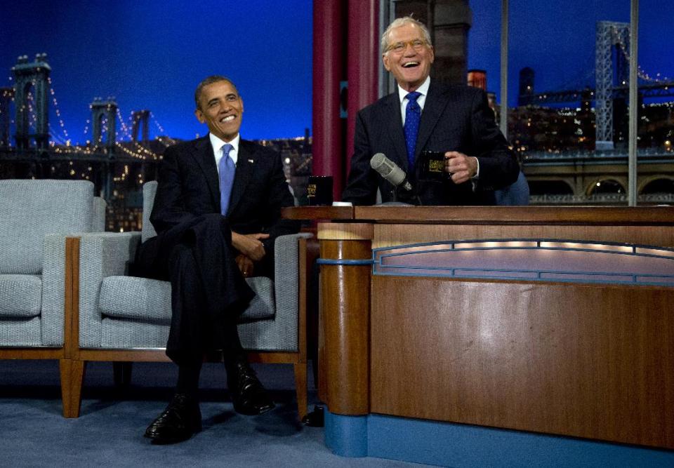 President Barack Obama sits with David Letterman on the set of the "Late Show With David Letterman" at the Ed Sullivan Theater, Tuesday, Sept. 18, 2012, in New York. (AP Photo/Carolyn Kaster)