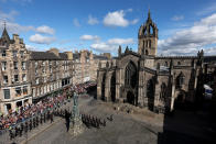 <p>Royal archers march outside St. Giles' Cathedral on September 12, 2022 in Edinburgh, Scotland. King Charles III joins the procession accompanying Her Majesty The Queen's coffin from the Palace of Holyroodhouse along the Royal Mile to St Giles Cathedral. The King and The Queen Consort, accompanied by other Members of the Royal Family also attend a Service of Prayer and Reflection for the Life of The Queen where it lies in rest for 24 hours before being transferred by air to London. (Photo by Russell Cheyne - WPA Pool/Getty Images)</p> 