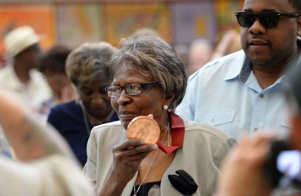 Mama Louise Hudson, original founder of H&H restaurant with her late cousin Inez Hill died Tuesday at the age of 93. File Photo. Louise Hudson displays the Tubman African American Museum Act of Courage Award she received for her years of service to the community. “Mama Louise” as she is better known, opened the H&H Restaurant downtown in 1952 with her cousin, Inez Hill, and “nourished a community” that included more than a few rock stars.