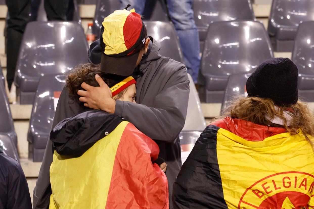 A supporter is comforted on the stands after suspension of the Euro 2024 qualifying match (Copyright 2023 The Associated Press. All rights reserved)