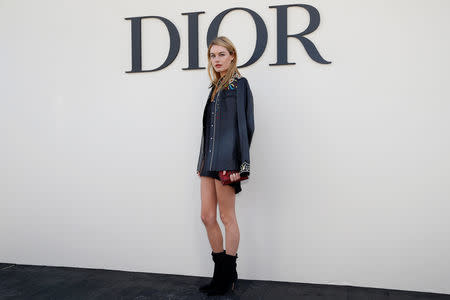 Model Camille Rowe poses during a photocall before the Spring/Summer 2019 women's ready-to-wear collection show for fashion house Dior during Paris Fashion Week in Paris, France, September 24, 2018. REUTERS/Stephane Mahe