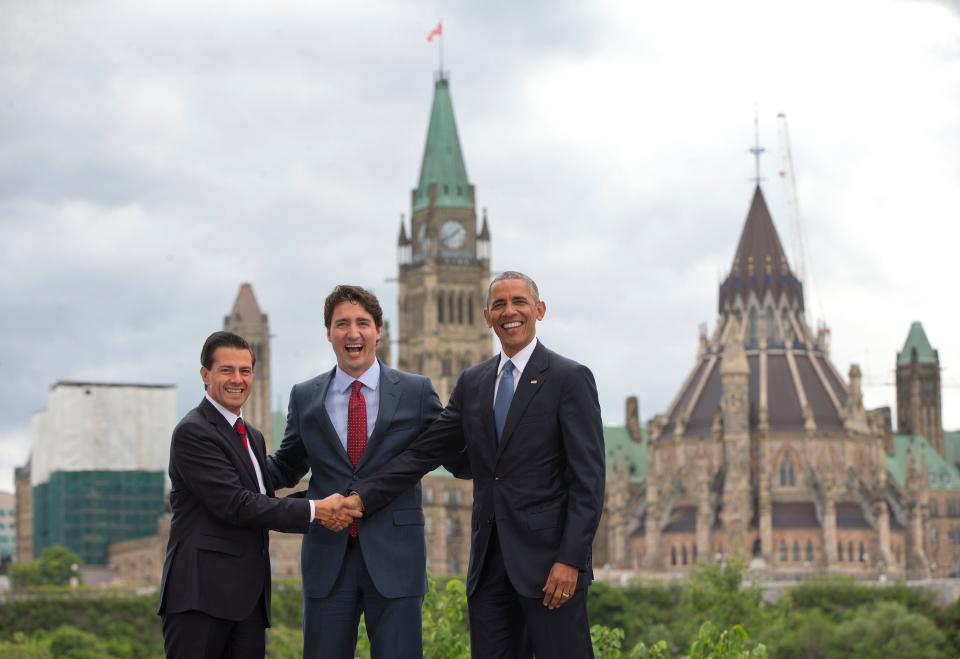 President Barack Obama, Canadian Prime Minister Justin Trudeau and Mexican President Enrique Pena Neito stand in front of Parliament Hill for a group photo during the North America Leaders' Summit at the National Gallery of Canada, in Ottawa, Canada.