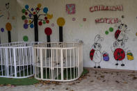 Empty cribs at a playhouse in the courtyard of Kherson regional children's home in Kherson, southern Ukraine, Friday, Nov. 25, 2022. Throughout the war in Ukraine, Russian authorities have been accused of deporting Ukrainian children to Russia or Russian-held territories to raise them as their own. At least 1,000 children were seized from schools and orphanages in the Kherson region during Russia’s eight-month occupation of the area, their whereabouts still unknown. (AP Photo/Bernat Armangue)