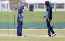 Cricket - Sri Lanka v India - Sri Lanka Team Practice Session - Galle, Sri Lanka - July 25, 2017 - Sri Lanka's Test cricket captain Rangana Herath and former captain Angelo Mathews inspect the pitch ahead of their first test match. REUTERS/Dinuka Liyanawatte