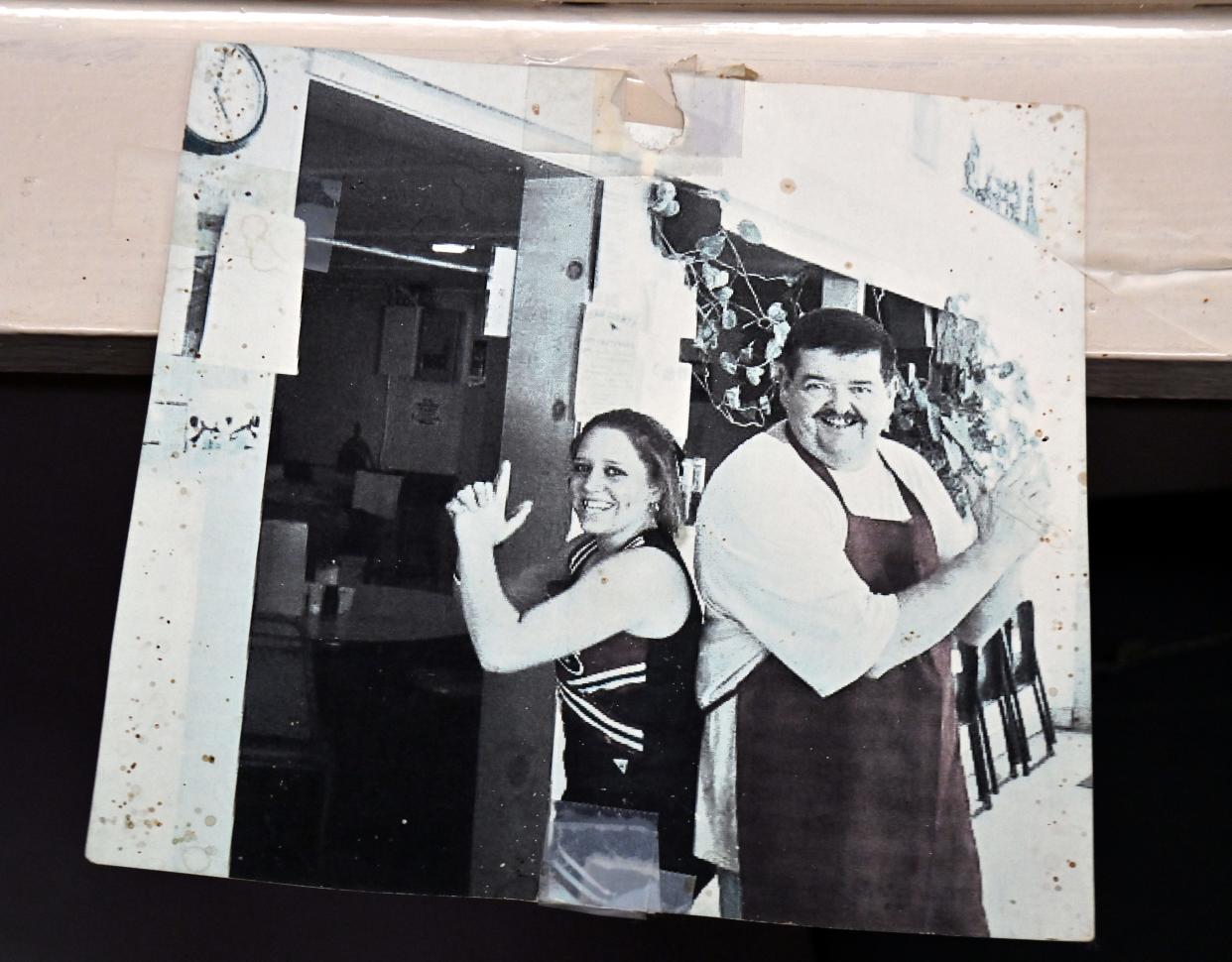 Julie Rae and Lynn Owens pose in a photograph hanging on the wall of Big O’s Restaurant in Valera April 16. Rae was one of Owen’s high school workers beginning in 2007.
