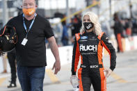 Driver Angela Ruch walks through the infield before a NASCAR Truck Series auto race at Charlotte Motor Speedway Tuesday, May 26, 2020 in Concord, N.C. (AP Photo/Gerry Broome)