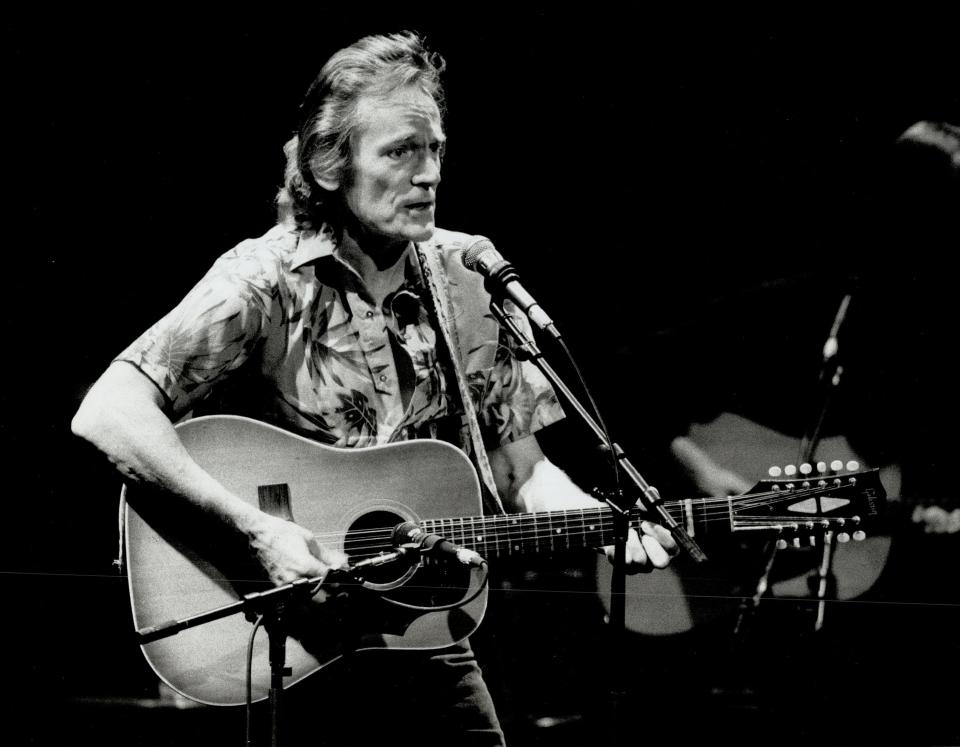 Gordon Lightfoot playing the guitar