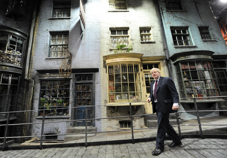 Mayor of London Boris Johnson walks down Diagon Alley as he visits the new attraction 'The Making of Harry Potter' at Warner Brothers studios in Leavesden, Hertfordshire. PRESS ASSOCIATION Photo Monday December 19, 2011. Photo credit should read: Anthony Devlin/PA Wire