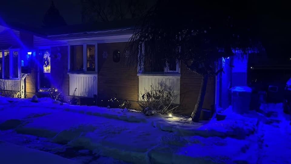 A Livonia home is decked out with blue lights to support the Detroit Lions.