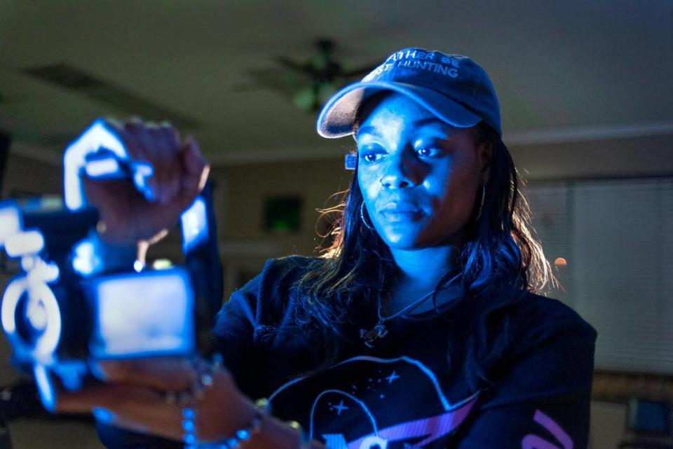 Marie Jackson uses an infrared camera to search for signs of paranormal activity at a Kansas City barbershop.