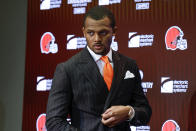 FILE - Cleveland Browns quarterback Deshaun Watson enters a news conference at the NFL football team's training facility, on March 25, 2022, in Berea, Ohio. The NFL suspended Watson for six games on Monday, Aug. 1, 2022 for violating its personal conduct policy following accusations of sexual misconduct made against him by two dozen women in Texas, two people familiar with the decision said. (AP Photo/Ron Schwane, File)