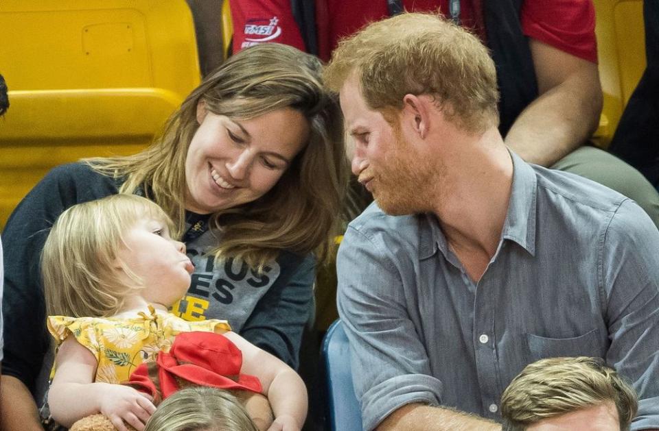 Prince Harry with young girl