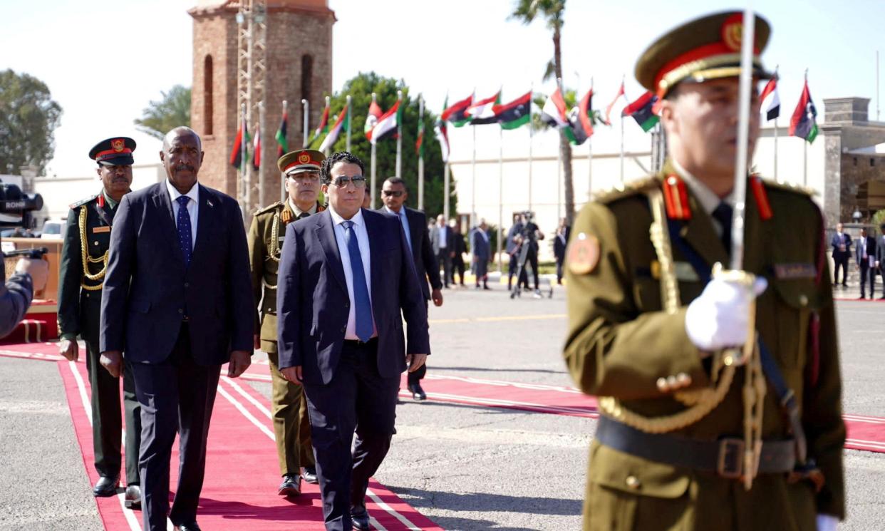 <span>Mohamed al-Menfi, the chair of the presidential council (centre), with Sudan's sovereign council chief, Gen Abdel Fattah al-Burhan, in Tripoli last month.</span><span>Photograph: Media Office Of Libya’S Government Of National Unity/Reuters</span>