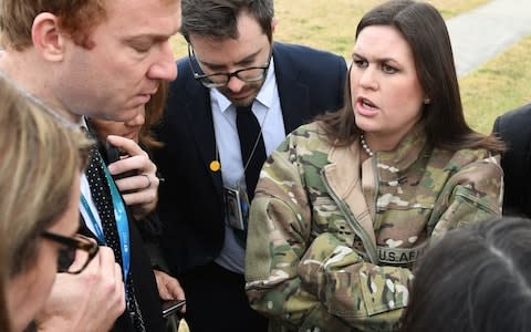 White House press secretary Sarah Huckabee Sanders speaks to reporters after presidential helicopters returned US President Donald Trump to US Army Garrison Yongsan in Seoul  - Credit: AFP