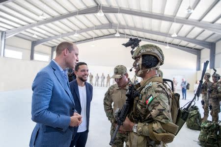 Britain's Prince William and Jordan's Crown Prince Hussein visit the Jordan Armed Forces Arab Army (Quick Reaction Force) base in Ajloun, Jordan June 25, 2018. Jordanian Royal Palace/Handout via Reuters