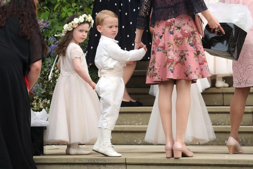 A young bridesmaid and pageboy on the steps