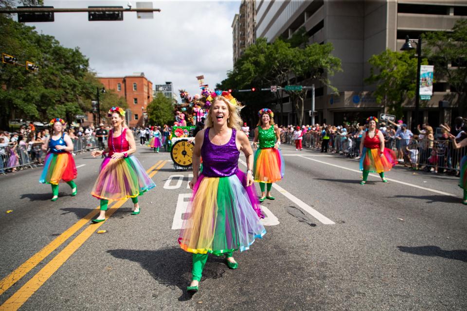 Groups and organizations take to Monroe Street tossing candy and beads as they participate in the annual Springtime Tallahassee parade Saturday, April 1, 2023.