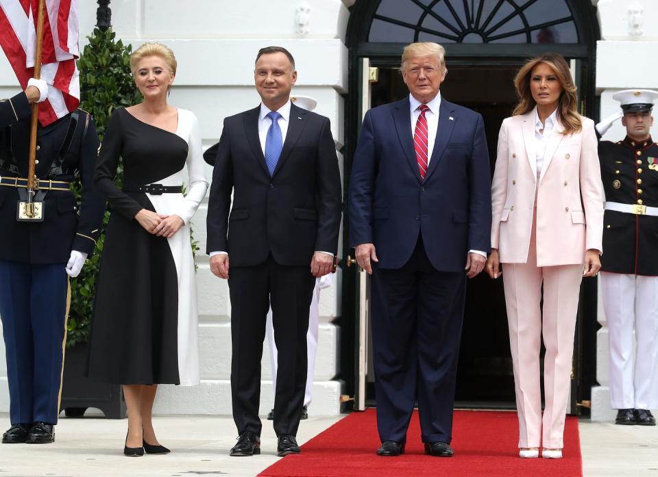 <p>Here Melania chose a soft pink, Calvin Klein 1960s-inspired tuxedo that gave her an air of Jackie Kennedy. The powder pink suit was tastefully paired with a pointy pair of white leather pumps as she greeted Polish President Andrzej Duda in mid June 2019.</p>