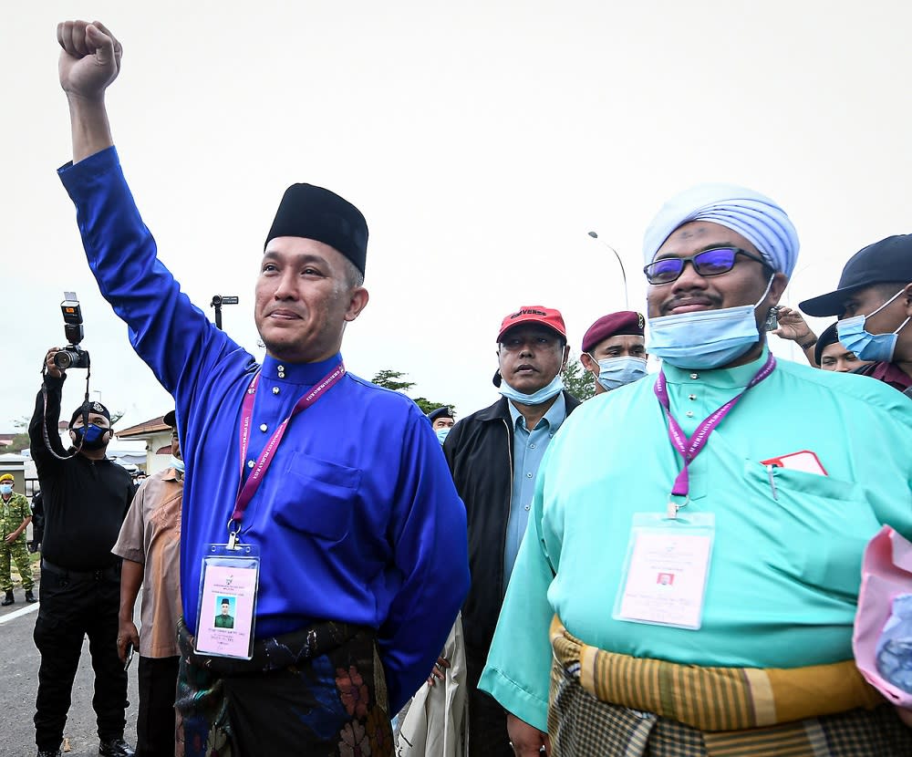 Barisan Nasional candidate Mohd Sharim Md Zain (left) arrives at the nomination centre in Pekan June 20, 2020. ― Bernama pic