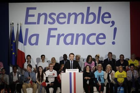 Emmanuel Macron, head of the political movement En Marche !, or Onwards !, and candidate for the 2017 presidential election, attends a campaign rally in Arras, France, April 26, 2017. REUTERS/Benoit Tessier