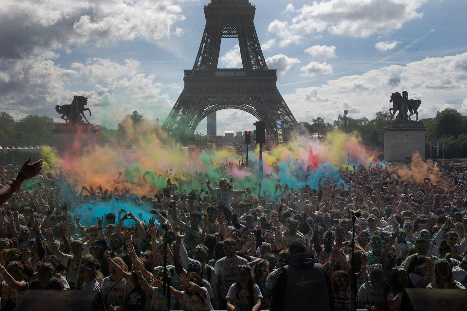 <p>Participants join the Color Run event near the Eiffel Tower in Paris, France, on April 16.</p>