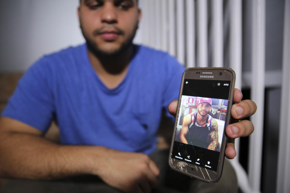 Christian Romero shows HuffPost&nbsp;a photo of his late brother Romsy on Oct. 14, 2017.&nbsp;The family says doctors believe he died after being infected with leptospirosis. (Photo: Carolina Moreno/HuffPost)