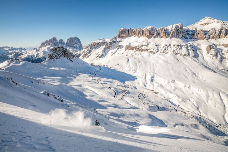 <span class="article__caption">Skier: Matthias Aigner, Location: skiing down from Sass Ciapel with views at Sass Pordoi and the road connecting Pordoi pass with Arabba</span> (Photo: Christophe Oberschenider)