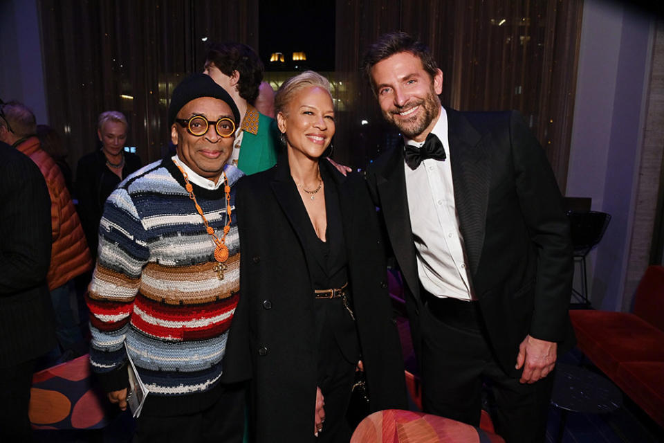 NEW YORK, NEW YORK - FEBRUARY 14: Spike Lee, Tonya Lewis Lee, and Bradley Cooper attend the Orchestrating Maestro special event at David Geffen Hall at Lincoln Center on February 14, 2024 in New York City.
