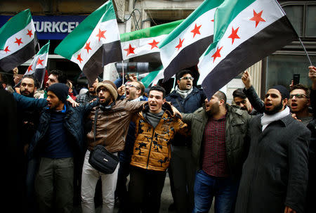 Syrians living in Istanbul gather in front of the Russian Consulate during a protest in Istanbul, Turkey February 22, 2018. REUTERS/Osman Orsal