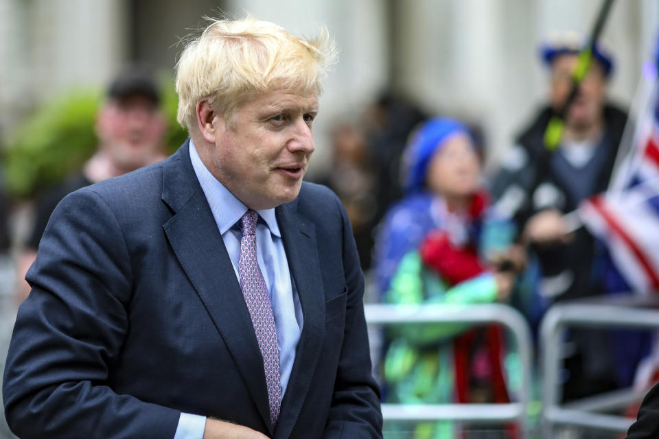 British Conservative Party leadership contender Boris Johnson arrives for a live TV debate in central London Tuesday, June 18, 2019. Britain's Conservative Party will continue to hold elimination votes until the final two contenders will be put to a vote of party members nationwide, with the winner due to replace Prime Minister Theresa May as party leader and prime minister.(AP Photo/Vudi Xhymshiti)