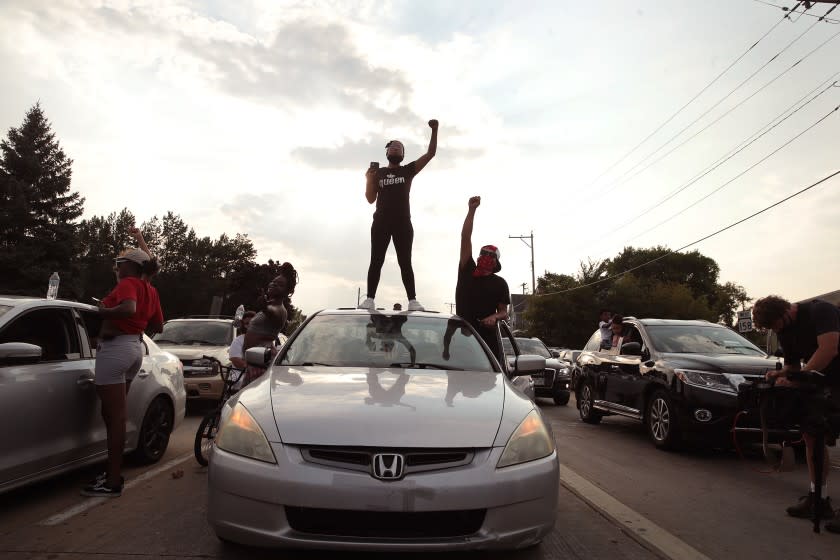 KENOSHA, WISCONSIN - AUGUST 24: Demonstrators protest in the streets during second night of unrest on August 24, 2020 in Kenosha, Wisconsin. Rioting as well as clashes between police and protesters began Sunday night after a police officer shot Jacob Blake 7 times in the back in front of his three children. (Photo by Scott Olson/Getty Images)