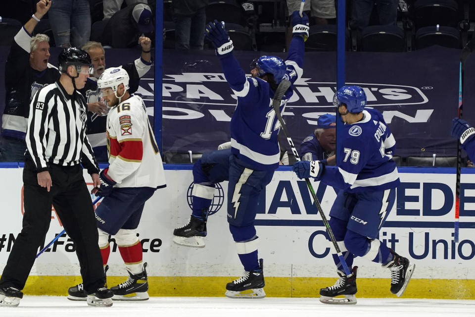 Tampa Bay Lightning left wing Pat Maroon (14) celebrates his goal against the Florida Panthers with left wing Ross Colton (79) during the first period in Game 6 of an NHL hockey Stanley Cup first-round playoff series Wednesday, May 26, 2021, in Tampa, Fla. (AP Photo/Chris O'Meara)