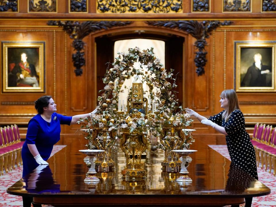 Royal Collection Trust members decorate the table in Waterloo Chamber.