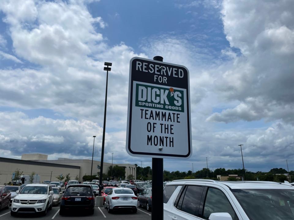 Cars fill the parking lot of the Independence Mall outside of Dick's Sporting Goods.