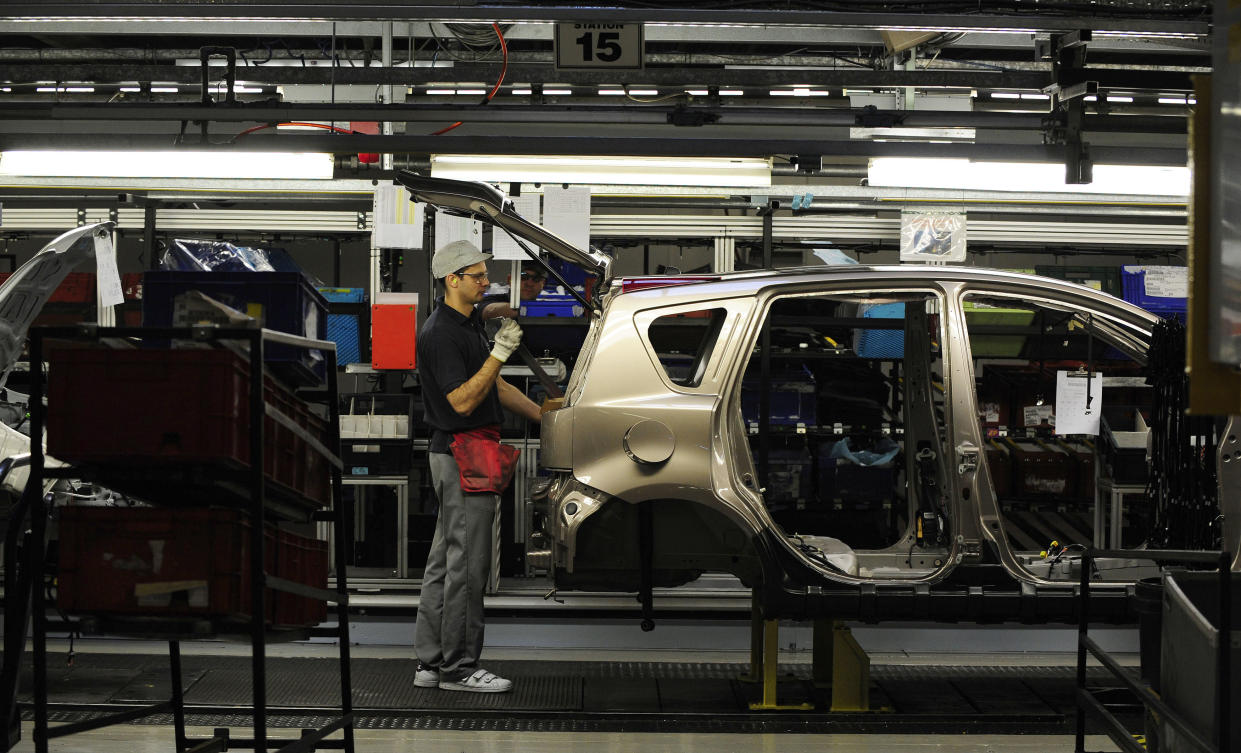 An employee works on the production line at the Nissan car factory in Washington, northern England. Photo: Nigel Roddis/Reuters