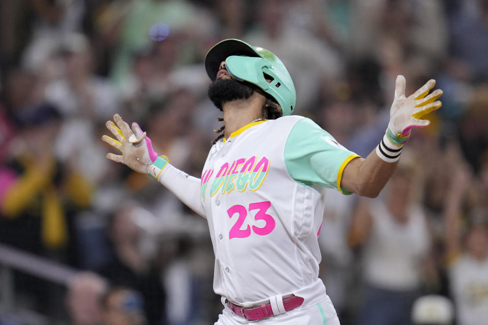 San Diego Padres' Fernando Tatis Jr. celebrates after hitting a home run during the fifth inning of a baseball game against the Texas Rangers, Friday, July 28, 2023, in San Diego. (AP Photo/Gregory Bull)