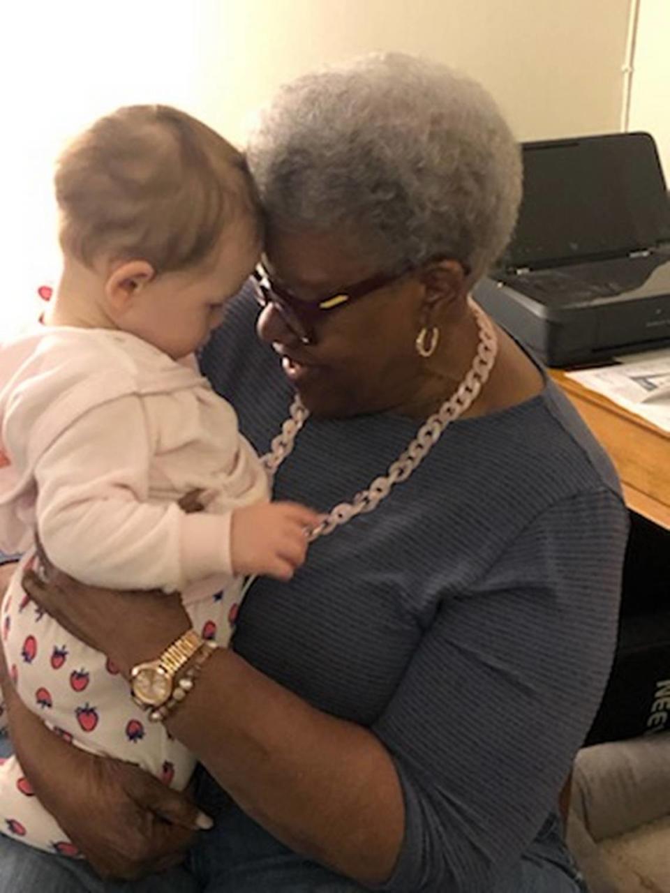 Bea Hines holding her 10-month-old great-granddaughter, Loretta Jane, for the first time on Monday, April 12, at the baby’s home in New York.
