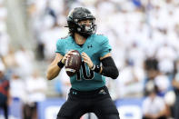 Coastal Carolina quarterback Grayson McCall (10) looks to pass during the first half of a NCAA college football game against Buffalo in Buffalo, N.Y. on Saturday, Sept. 18, 2021. (AP Photo/Joshua Bessex)