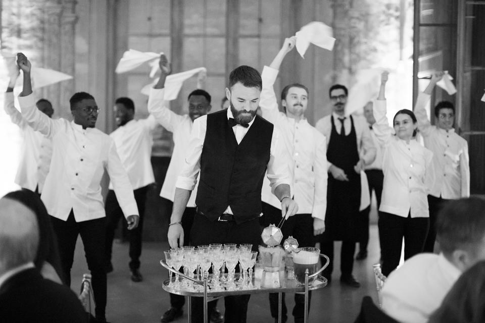 <p>During dinner, which featured three different courses of pasta from a Michelin star restaurant in Rome, waiters sabered bottles of bubbly and pushed carts around with oysters, steak tartare and espresso martinis.</p>