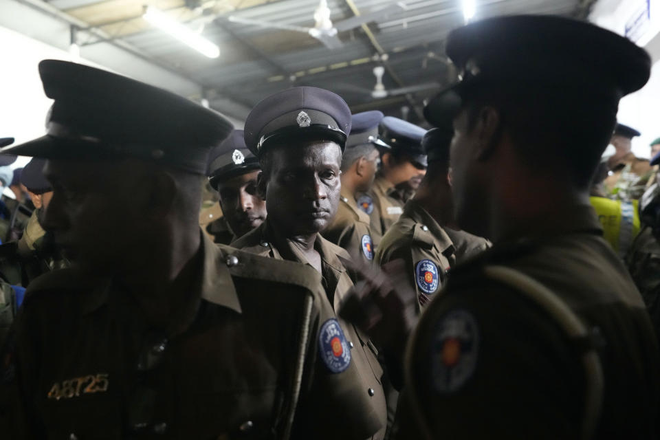 Sri Lankan police officers receive instructions as they prepare for a search operation against narcotics at a neighborhood in Colombo, Sri Lanka, Thursday, Jan. 18, 2024. (AP Photo/Eranga Jayawardena)