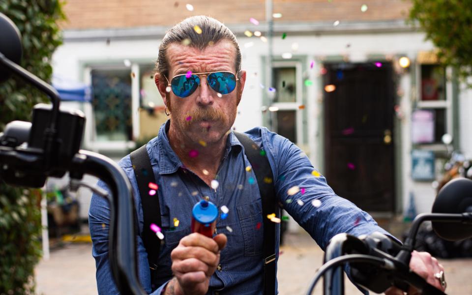 Jesse Hughes of Eagles of Death Metal poses with a confetti gun on his motorcycle Dec. 19, 2019 in Los Angeles.