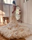 <p>To walk down the aisle, the beautiful bride opted for an ivory gown with a dramatic ruffled train, also by Ralph Lauren. </p>