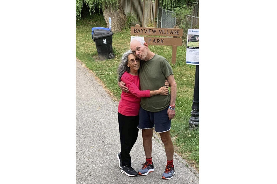 In this undated, unknown location photo released by Iris Weinstein Haggai, Judih Weinstein and Gad Haggai hold each other as they pose for a photo. (Iris Weinstein Haggai via AP)