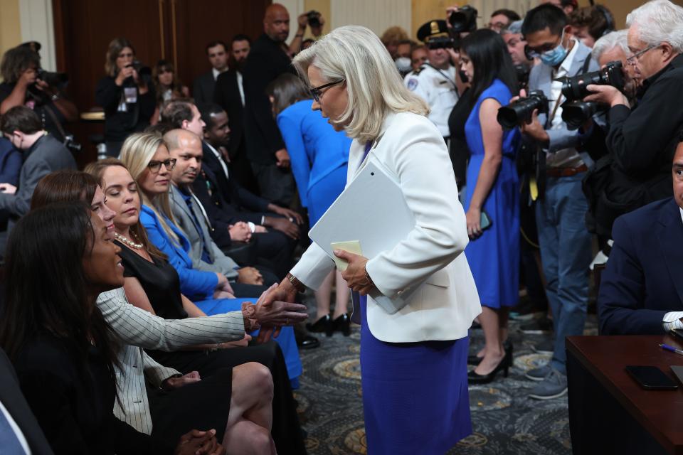 Rep. Liz Cheney (R-WY), Vice Chairwoman of the House Select Committee to Investigate the January 6th Attack on the U.S. Capitol, shakes hands with law enforcement officers and their supporters at the conclusion of a prime-time hearing in the Cannon House Office Building on July 21, 2022 in Washington, DC.