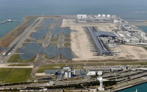 Kansai International Airport is partially flooded by Typhoon Jebi in Osaka, western Japan, on Wednesday - Credit: AP