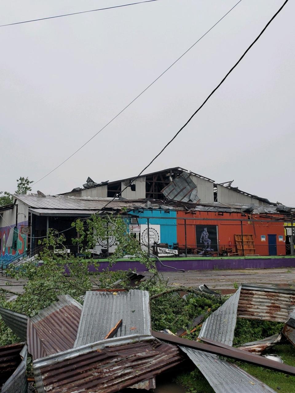 Major damage being seen in the Railroad Square Art District, including split trees and damage to structures.