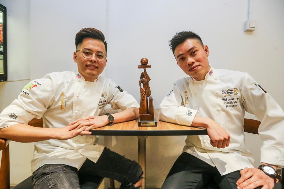 Loi Ming Ai (left) and Tan Wei Loon with the World Pastry Cup trophy. — Picture by Hari Anggara