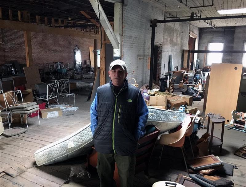 Michael Keene, co-owner of Taunton Antiques Center, in January 2018 stands in an empty third-floor space that is part of the Union Block apartment development plan.