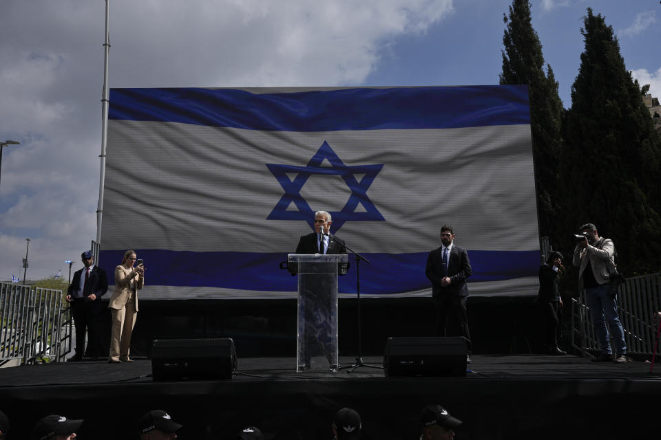 Yair Lapid, leader of opposition's Yeah Atid party addresses Israelis protesting against Prime Minister Benjamin Netanyahu's judicial overhaul plan outside the parliament in Jerusalem, Monday, March 27, 2023. (AP Photo/Ohad Zwigenberg)